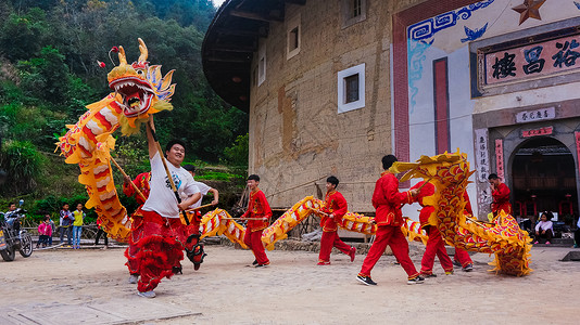 民族歌舞表演福建南靖土楼的舞龙舞狮背景
