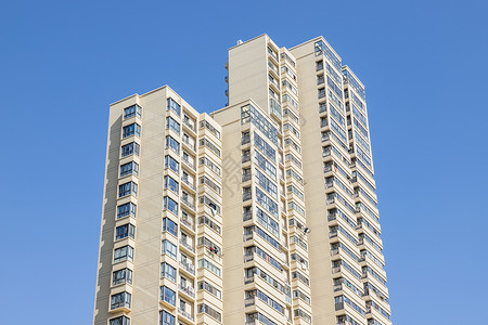 蓝天下的居民楼背景图片