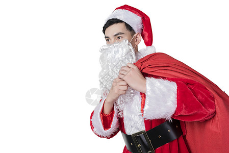 圣诞老人背礼物包裹背景图片