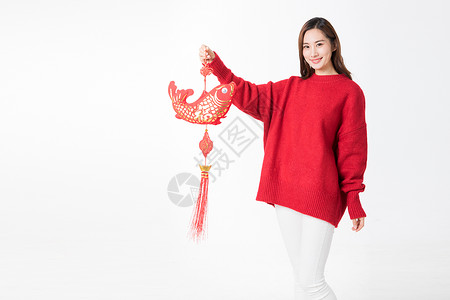 新年女性拿红色中国结背景图片
