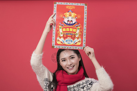 好运中国年海报手拿新年装饰的女性背景