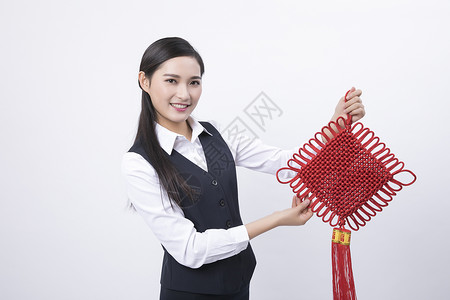 手拿中国结的职业女性图片