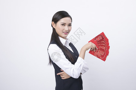 手拿红包的商务女性人像背景图片