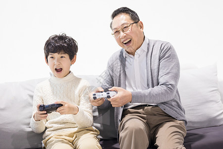一家人玩游戏爷爷和孙子一起玩游戏背景