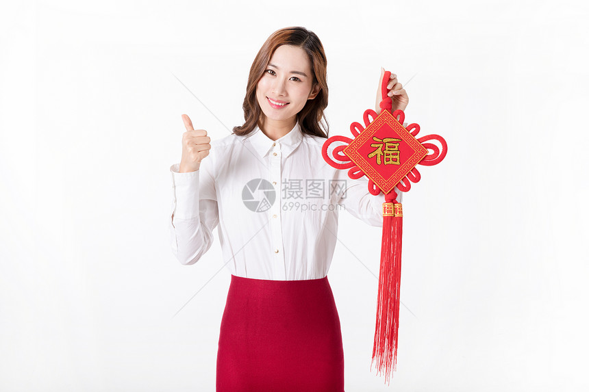 商务新年女性手拿中国结图片