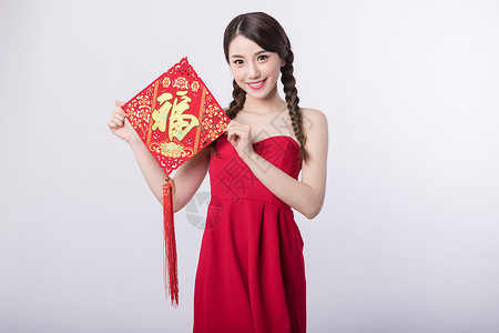 小红裙就是焦点新春手拿福字中国结的女孩背景