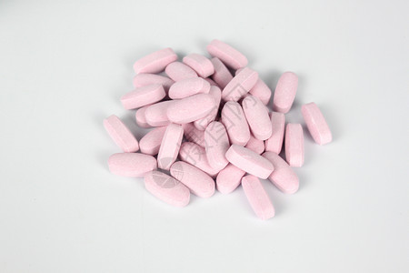粉色小药片背景图片