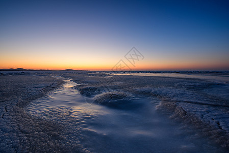 瓦房店落日下的海冰背景