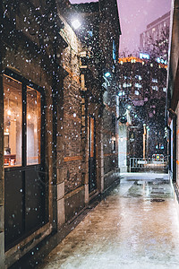 冬天街道夜景城市街道的雪景背景
