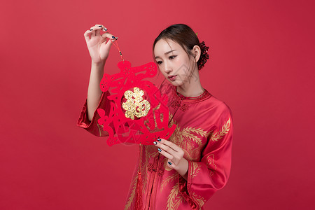 旗袍女性美妆手持中国结图片
