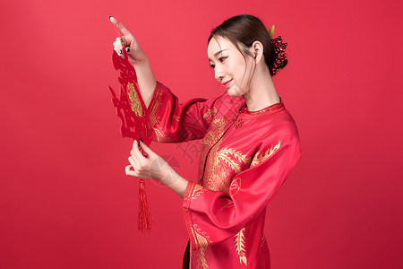 旗袍女性美妆手持中国结图片