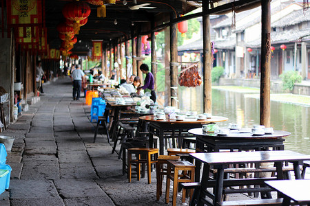 餐馆图标安昌古镇廊棚下的餐馆背景