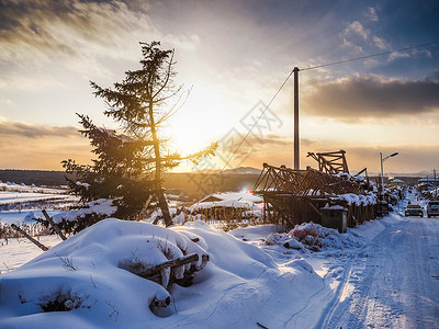 东北日落黄昏雪景背景图片