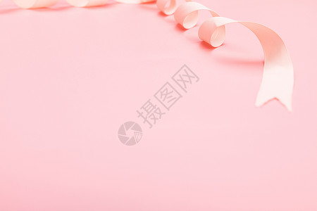 粉色背景丝绸缎带静物背景图片
