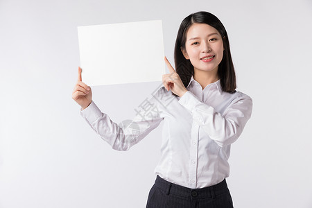 白纸展示职场女性手拿留白卡纸展示动作背景