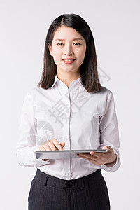 职场女性手拿平板电脑高清图片