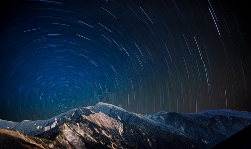 山峰小道星轨背景山峰星轨背景设计图片