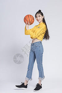 女生篮球玩篮球的青年女性背景