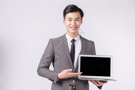 手铁盒子样机手拿笔记本电脑展示的商务人士背景