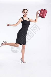 青年职业女性提包上班背景图片