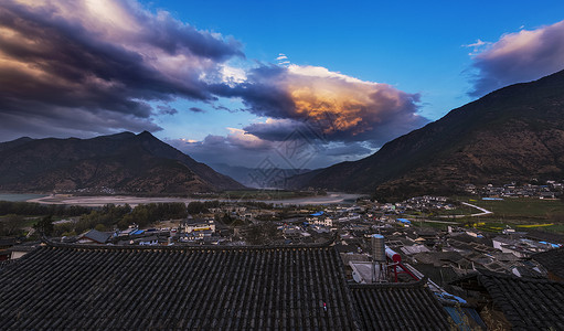 落日映石鼓背景图片