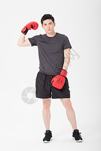 健身男性戴拳击手套肌肉展示模特高清图片素材