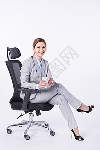 坐着喝咖啡的外国商务女性高清图片