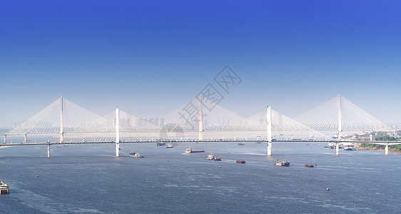 船桥梁蓝天下武汉长江上的桥梁背景