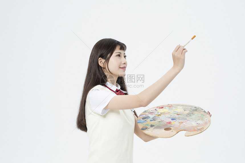 拿着画板的女学生图片