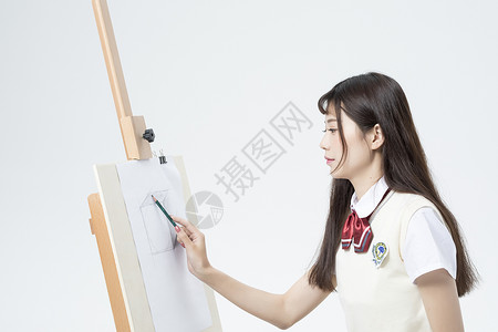 画画的女学生背景图片