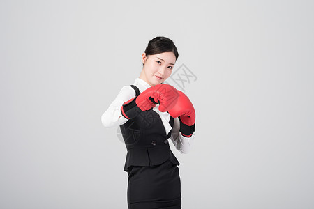 戴着拳击手套的职场女性图片戴着拳击手套的职场女性背景