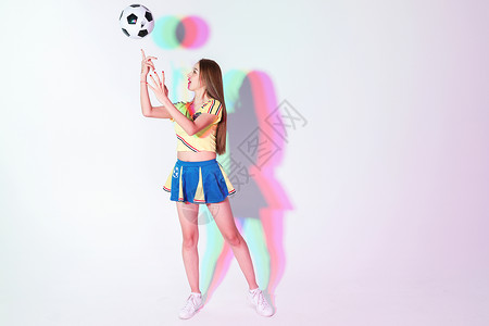 年轻女性色彩创意玩游戏机活力少女足球宝贝形象背景