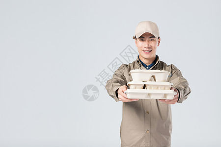 纸餐盒递餐的外卖员背景