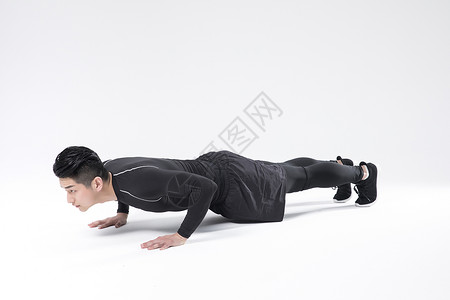 健壮单人运动做俯卧撑的运动男性背景