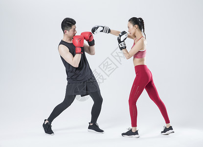 男女打架一起拳击的运动男女背景