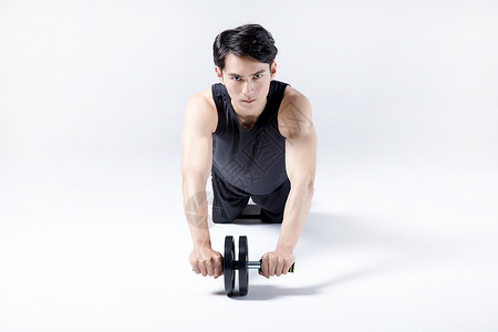 钢丝拉伸器健身运动男性人像健腹器背景