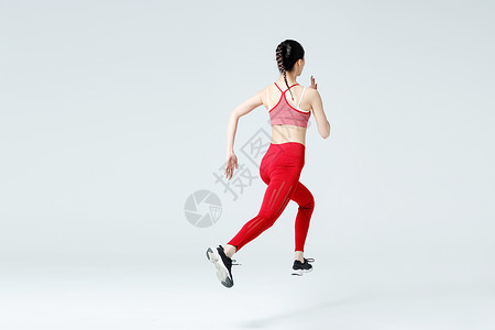 大步跑步冲刺的健身女性健身女性跑步冲刺背影背景