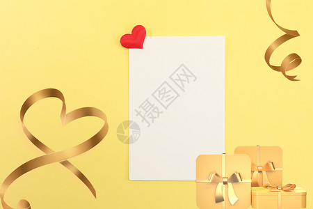 黄色飘逸丝带黄色节日礼盒背景设计图片