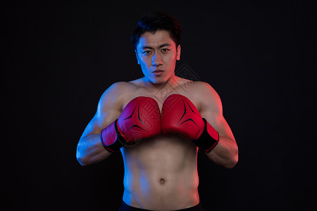 运动男性拳击肌肉创意照运动健身男性拳击手套红蓝创意照背景
