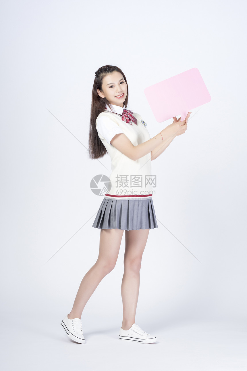 拿着对话框的女学生图片