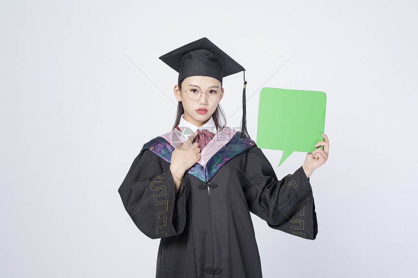 拿着文字框的毕业女学生图片