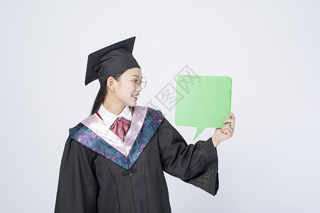 拿着文字框的毕业女学生背景图片