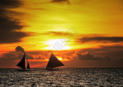长滩岛日落帆船背景图片