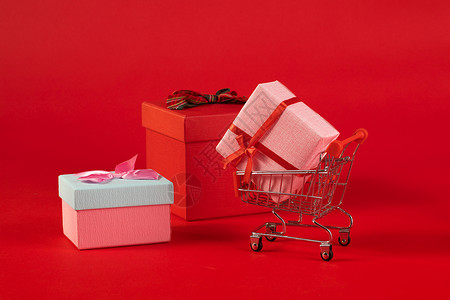 双十一购物狂欢节购物车和礼品盒背景