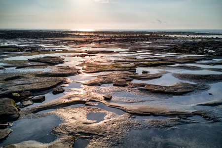 水洼图片广西北海涠洲岛日出风景背景