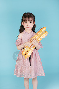 小女孩儿童节面包背景图片