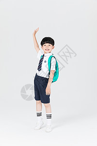 背书包男孩背着书包准备上学的小男生男孩背景
