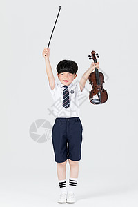 拉小提琴表演的小男孩背景图片