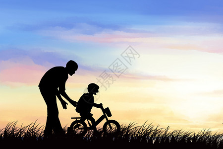 骑自行的儿童夕阳下的父子设计图片