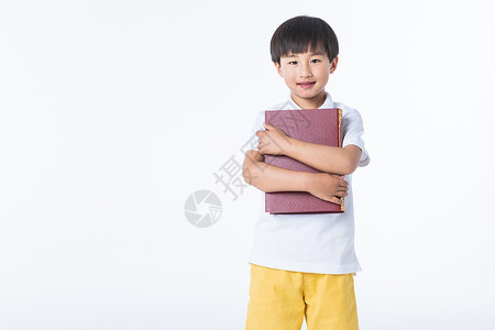 可爱孩子拿着书图片
